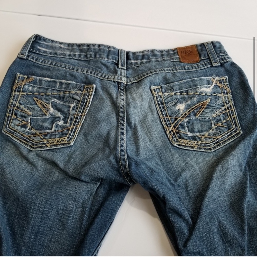 BKE Star jeans. Size 27 waist 33 1/2 long fringe bottoms distressed in places